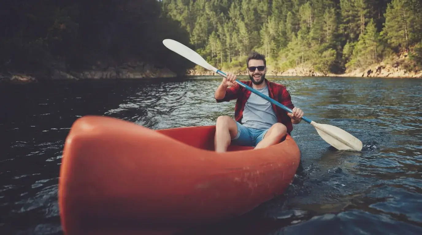 Person enjoying canoeing, a spine-friendly outdoor activity that promotes movement and fitness.